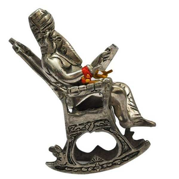 Ganesha Lord Statue Sitting On A Chair And Reading Ramayan Silver Showpiece