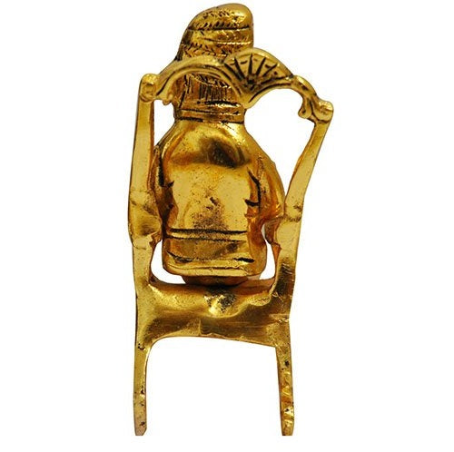 Lord Ganesha Statue Sitting on A Chair And Reading Ramayan