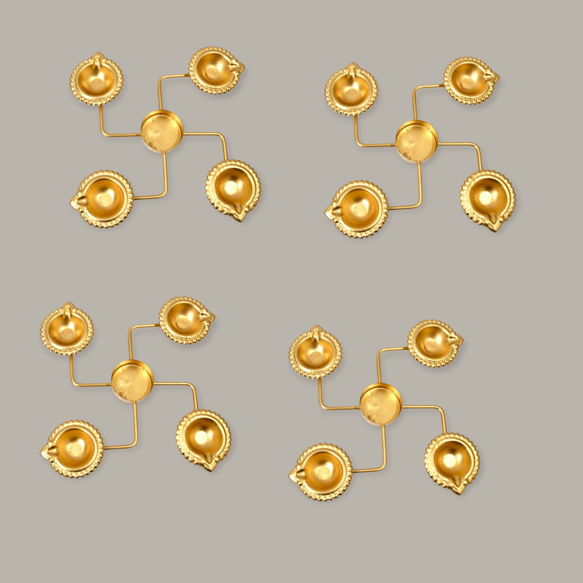 Set of gold earrings on a gray background