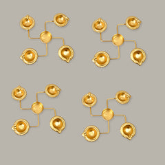 Set of gold earrings on a gray background