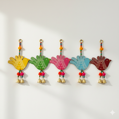 Set of colorful hand-shaped wall hangings with bells on a white background