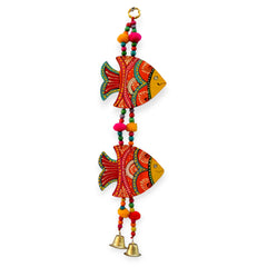 Decorative hanging with colorful fish designs and bells on a white background