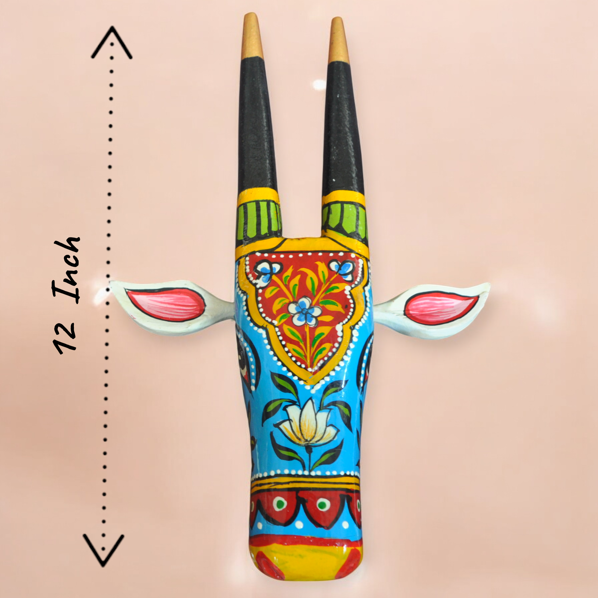 Decorative wall art with painted horns on a beige background